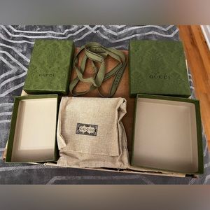 Two small Gucci boxes + small dust bag.